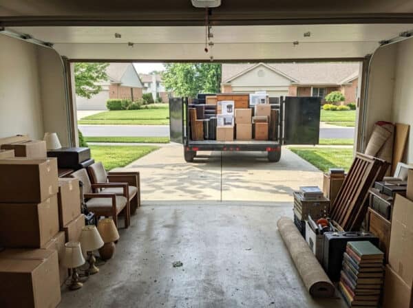 Moving truck with boxes and furniture in garage for Profi Property Solutions LLC.