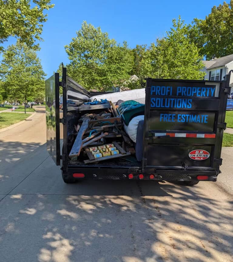 Dumpster filled with construction debris for Profi Property Solutions LLC.