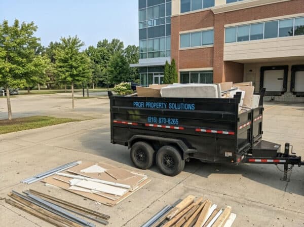Profi Property Solutions LLC truck with construction materials in parking lot.